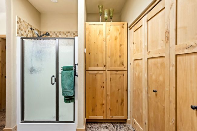 Storage space and stand up shower | Image 43
