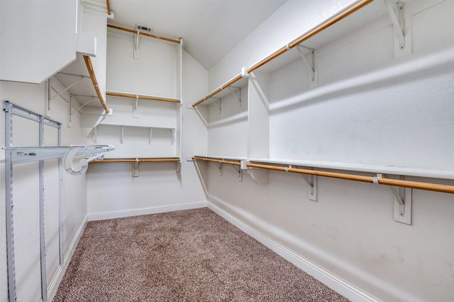 Walk in closet with carpet flooring | Image 16