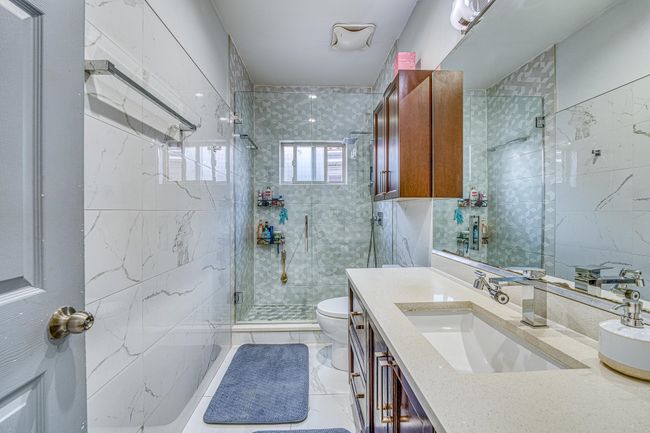 Full bathroom with a stall shower and vanity | Image 15