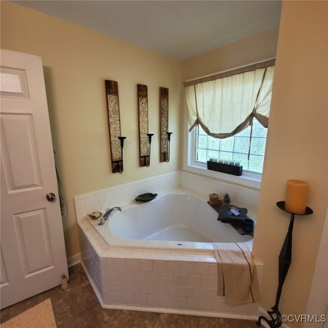 Full bathroom with a bath | Image 36