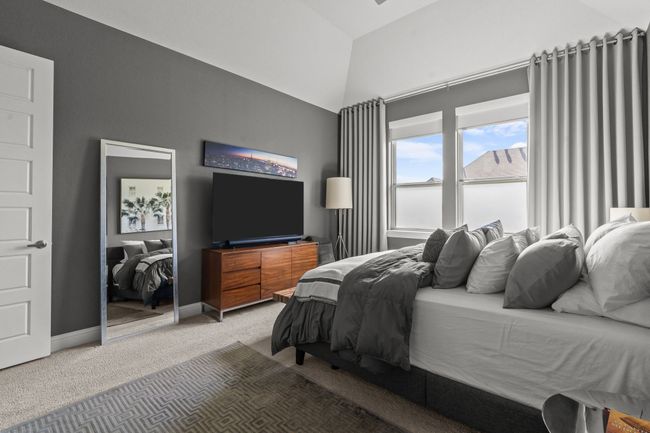 Bedroom with light carpet and vaulted ceiling | Image 13