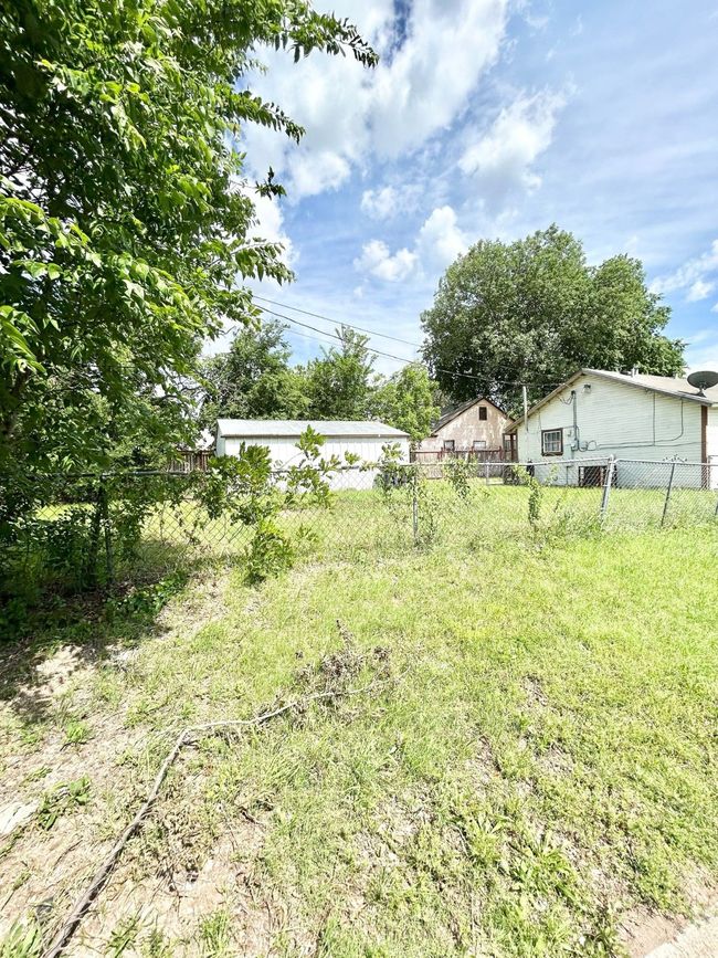 View of yard with fence | Image 4