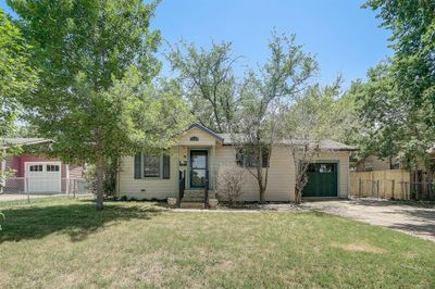 View of front of property with a garage and a front lawn | Image 2