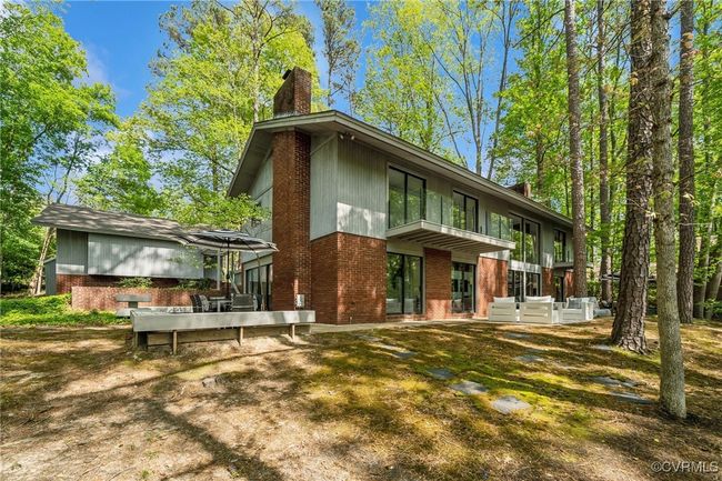 Rear view of property featuring brick siding and a chimney | Image 4
