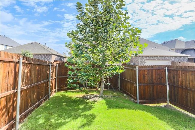 View of fenced backyard | Image 31