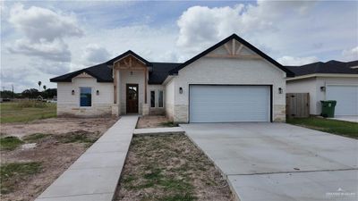 View of front facade with a garage | Image 1