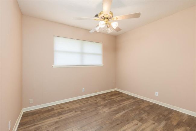 2nd Bedroom has wood laminate flooring and recent light fixture | Image 18