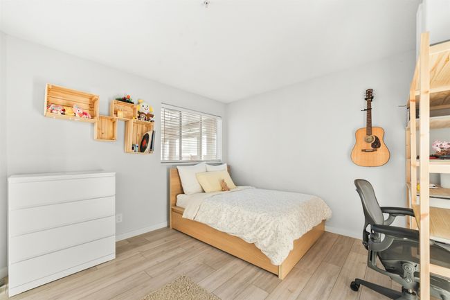 Bedroom featuring baseboards and wood finished floors | Image 20