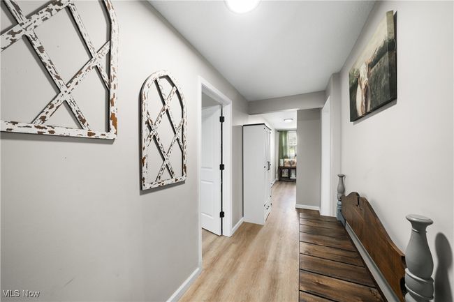 Corridor with wood finished floors and baseboards | Image 16
