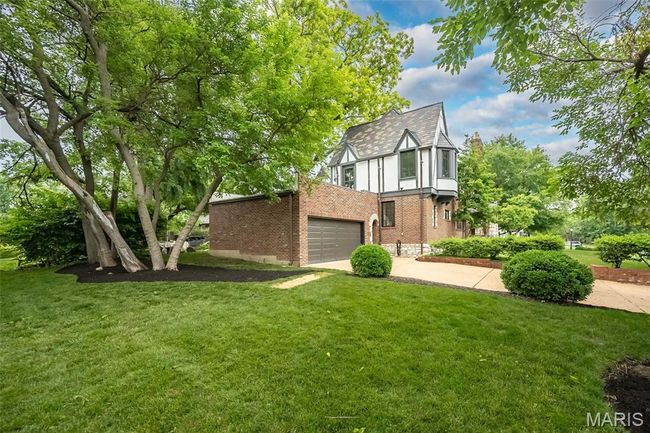 The home features a large yard for the neighborhood. | Image 33