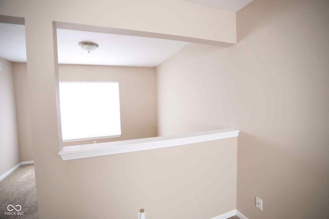 interior space with baseboards | Image 11