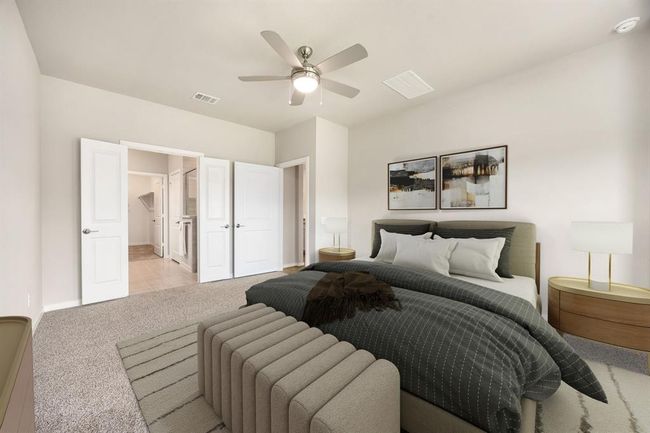 Virtually staged Primary Bedroom with a private en suite. | Image 15