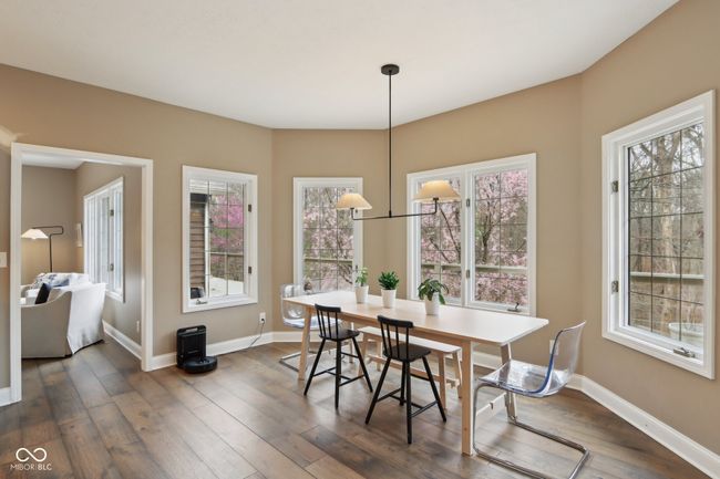 dining room with baseboards and dark wood-type flooring | Image 19