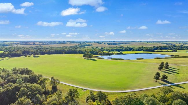 Drone / aerial view of a large body of water and a golf club | Image 5