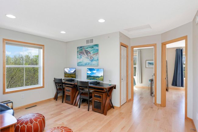 Upper level features LVP maple hardwood flooring throughout | Image 15