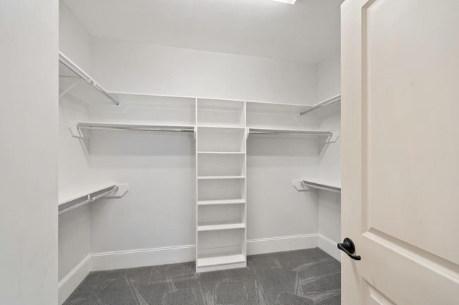 Walk-in primary closet. | Image 19