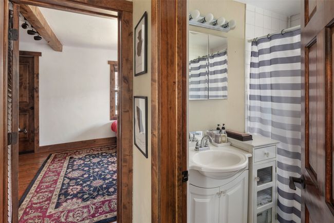 Full bathroom featuring vanity, wood finished floors, and baseboards | Image 19