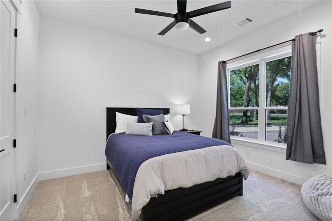Carpeted bedroom with ceiling fan, baseboards, visible vents, and recessed lighting | Image 24