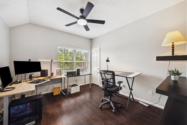 Fifth generously sized bedroom with new fan (2/24), beautiful engineered wood flooring, nice sized closet and window blinds, currently used as an office. | Image 46