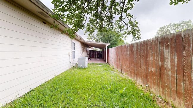 View of yard with central air condition unit and fence | Image 27
