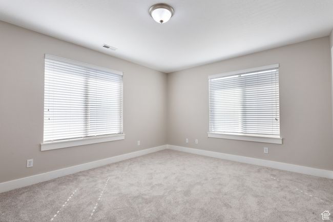 Unfurnished room with carpet floors and baseboards | Image 19
