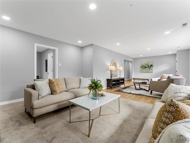 Living room with light wood-style flooring, visible vents, baseboards, and recessed lighting | Image 12