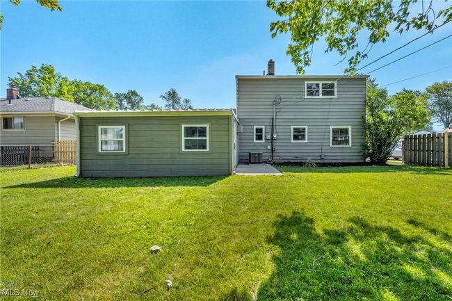 Rear view of property featuring a chimney | Image 42