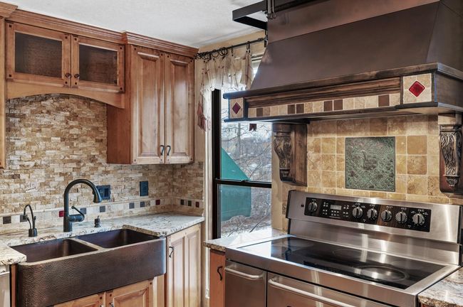 Looking out onto the courtyard from your Chef's range. The copper inset was imported from Italy. | Image 18