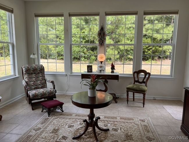 Living area featuring light tile patterned floors | Image 41
