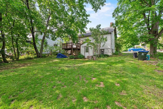 View of grassy yard with a deck | Image 19