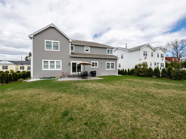 Back of house featuring a lawn and a patio | Image 23