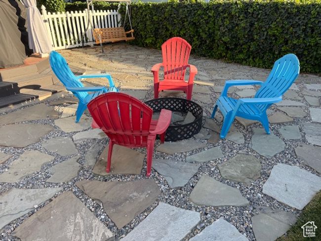 View of patio / terrace featuring a fire pit | Image 47