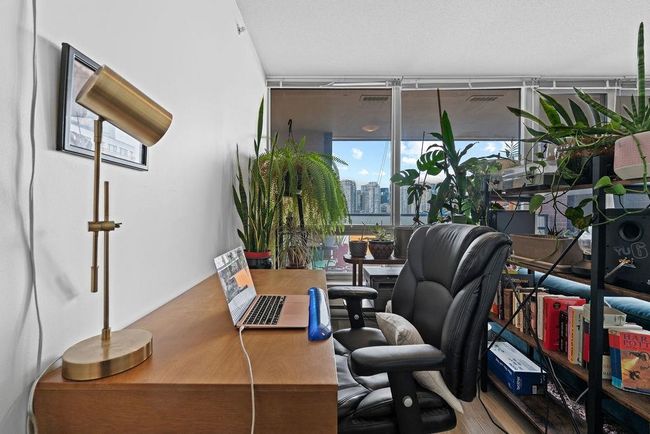 Office featuring a view of city, wood finished floors, and floor to ceiling windows | Image 20