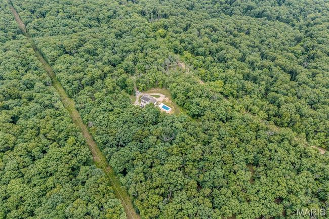 Aerial view of a heavily wooded area | Image 84