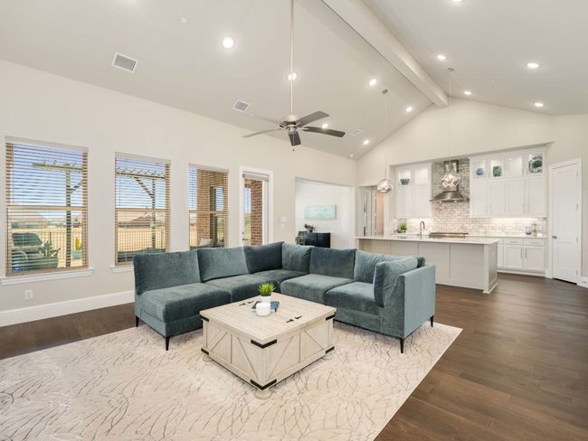 Spacious living room is a wood burning gas fireplace | Image 10