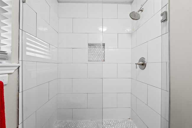 Bathroom featuring tiled shower | Image 17
