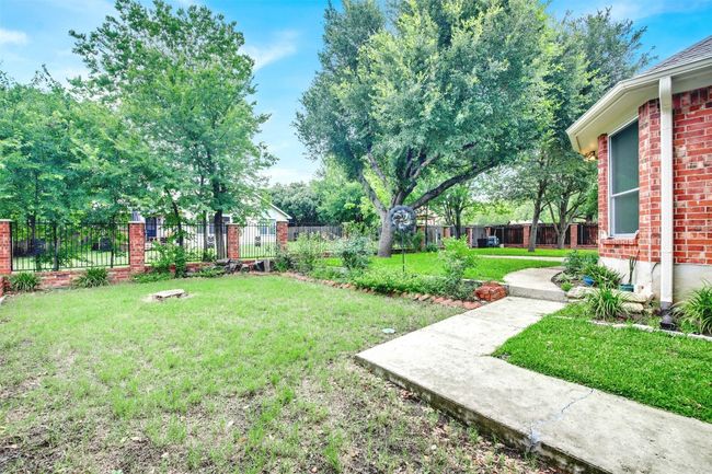View of fenced backyard | Image 37