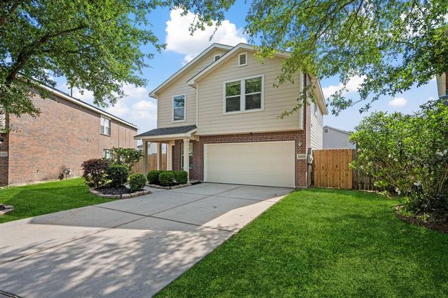 Driveway and garage view from the front of the home. | Image 26