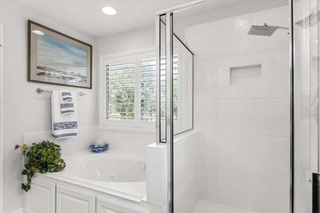 Full bathroom with a stall shower and a jetted tub | Image 31