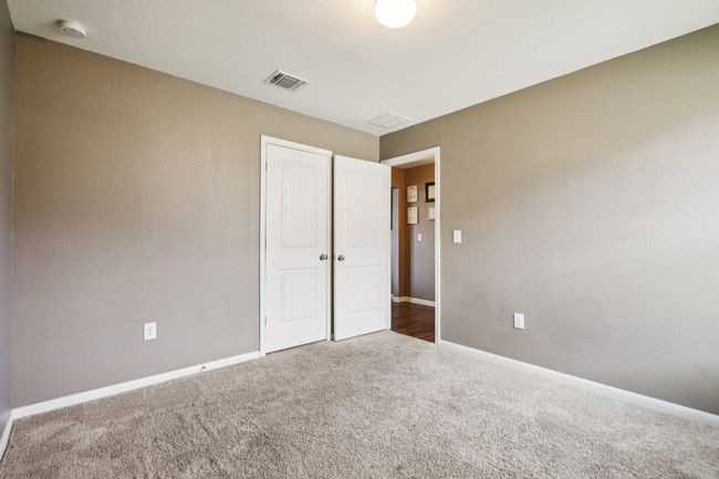 Unfurnished bedroom with carpet and a closet | Image 27