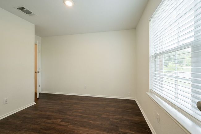 Spare room with dark wood-style floors, baseboards, and recessed lighting | Image 29