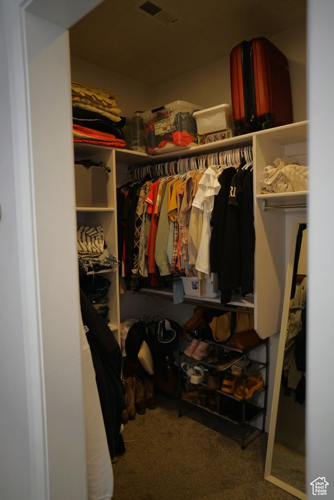 Walk in closet with carpet and visible vents | Image 25