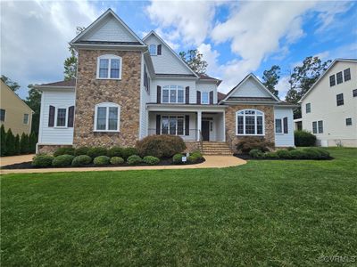 View of front of house featuring a front lawn and a porch | Image 1