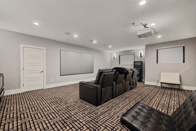 A spacious media room designed for ultimate entertainment, offering the perfect space for movies, gaming, and relaxation. | Image 36