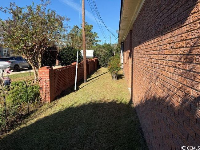 View of property exterior with a lawn | Image 36