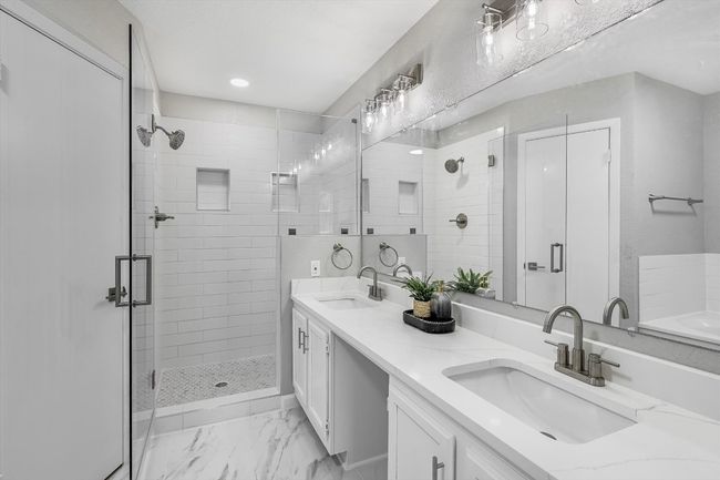 Full bathroom with a sink, a shower stall, double vanity, and recessed lighting | Image 11