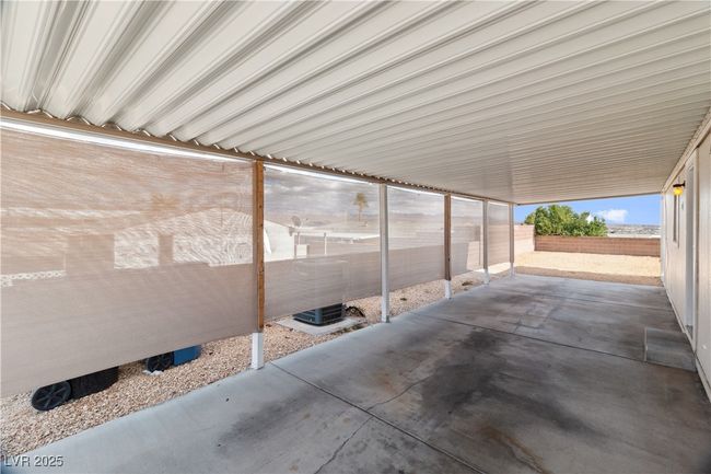 View of parking featuring access to backyard | Image 32