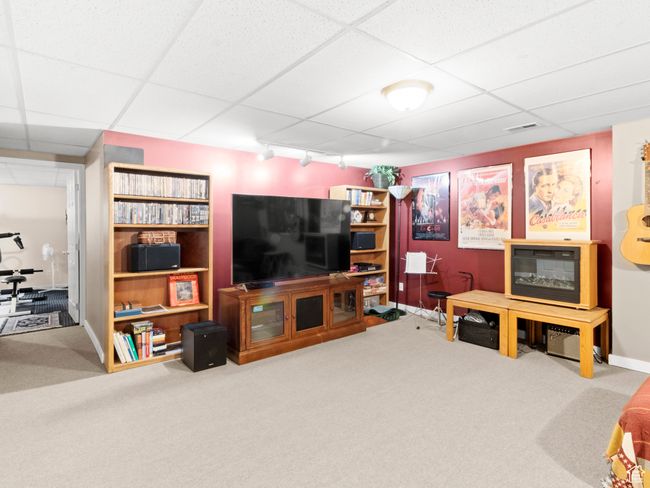 Living space featuring carpet, rail lighting | Image 18