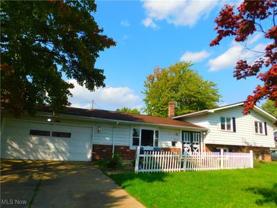 View of front of property with a front lawn and a garage | Image 2