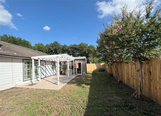 2025 fences added in back yard with a well-built storage room with lighting and power, having a potential to be a sunroom. | Image 21